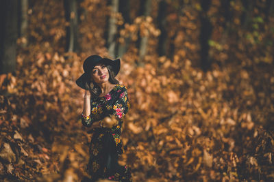 Woman looking away in forest