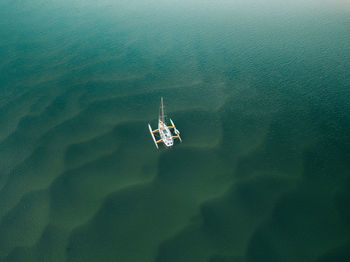 High angle view of ship sailing on sea