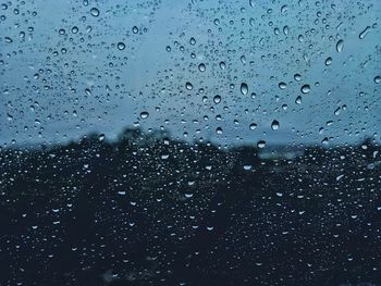 Full frame shot of wet glass window