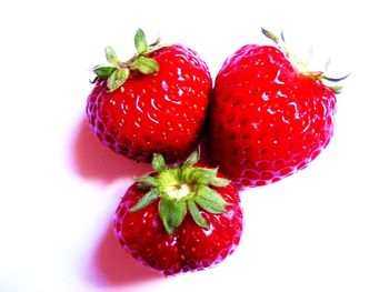 Close-up of strawberries on white background