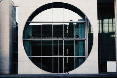 Reflection of building on glass window