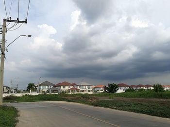 Empty road along countryside landscape