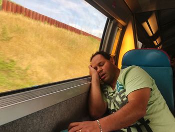 Man sleeping in train