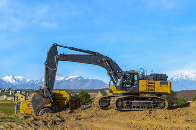 Construction site on field against sky