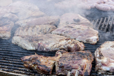 High angle view of fish on barbecue grill