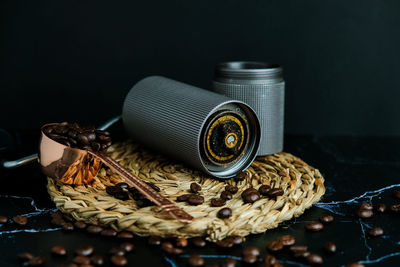 Close-up of coffee beans in basket on table