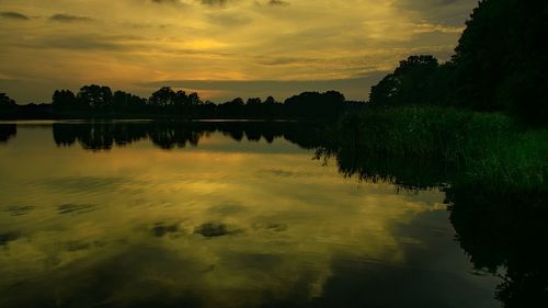 Scenic view of lake against sky during sunset