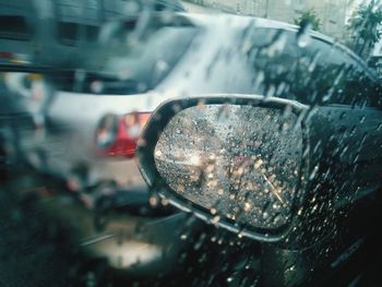 Close-up of raindrops on car window