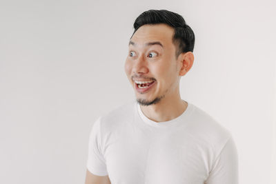 Portrait of young man against white background