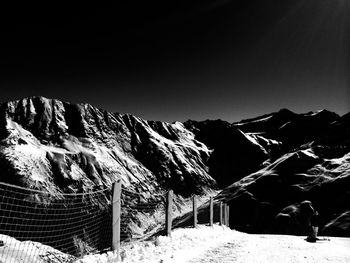 Scenic view of snowcapped mountains against clear sky