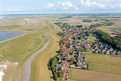 Aerial from the traditional village moddergat at the wadden sea in friesland the netherlands