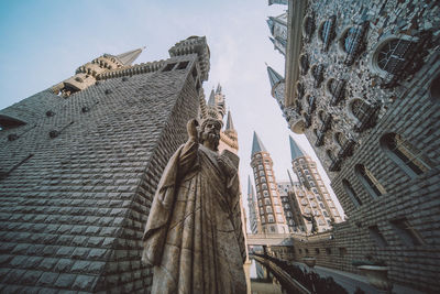 Low angle view of buildings against sky in city