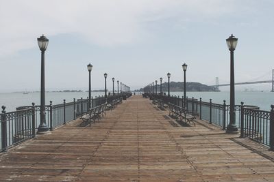 Pier over sea against sky