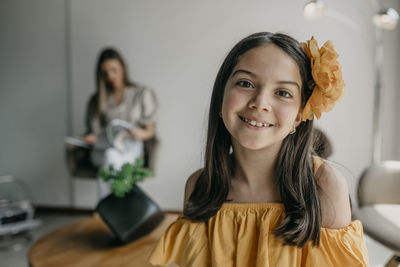 Portrait of smiling young woman at home