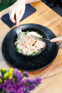 High angle view of person preparing food on table