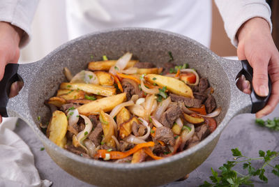 Midsection of person preparing food