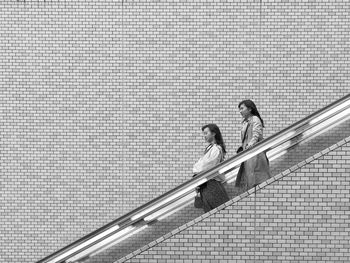 Low angle view of people on staircase