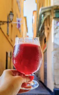 Close-up of hand holding drink