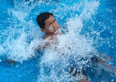 Man swimming in pool