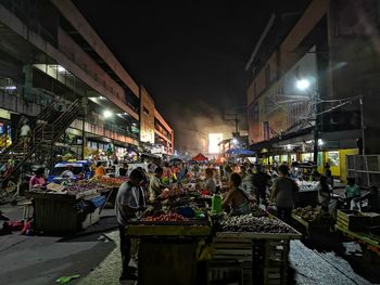 Group of people in market at night