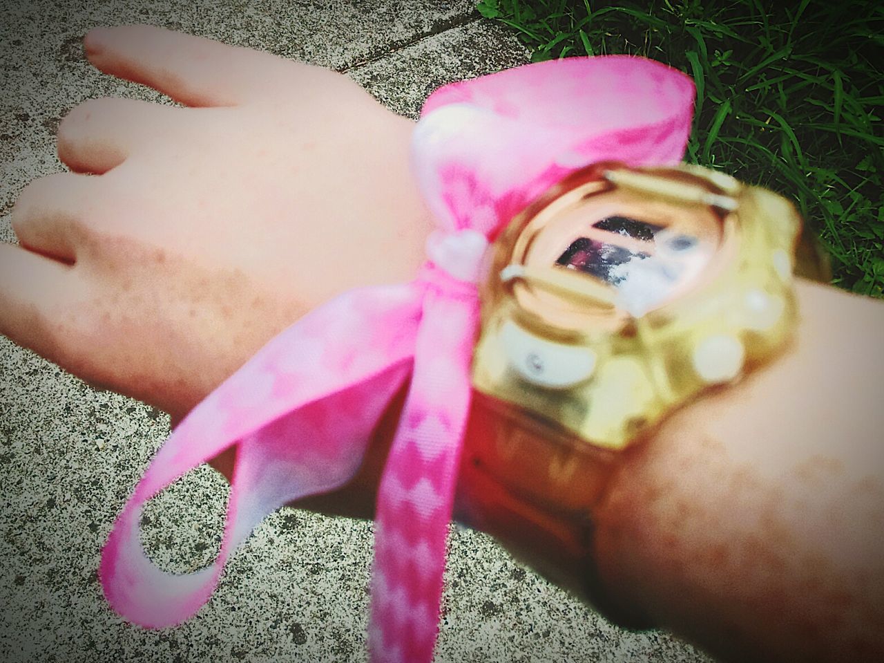 pink color, one person, real people, close-up, human body part, women, childhood, child, toy, day, selective focus, high angle view, representation, shoe, body part, holding, human leg, outdoors, human foot