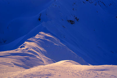 Scenic view of snowcapped mountains during winter