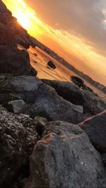 Scenic view of beach against sky during sunset