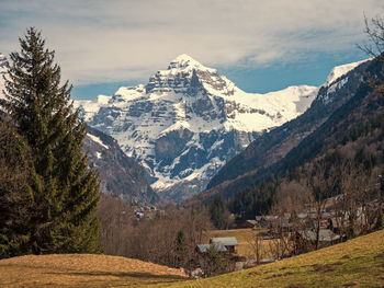 Scenic view of snowcapped mountains against sky