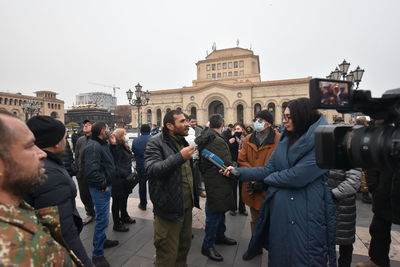 Group of people in front of building