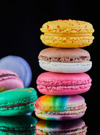 Close-up of macaroons against black background