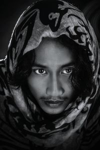 Close-up portrait of man wearing scarf