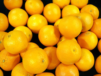 Full frame shot of oranges at market stall