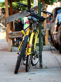 Bicycle parked on street in city