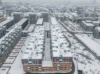 High angle view of buildings in city during winter