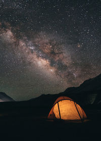 Low angle view of tent against star field