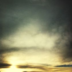 Low angle view of cloudy sky at sunset