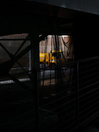 Metal bridge amidst buildings in city