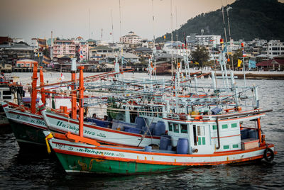 Boats moored at harbor