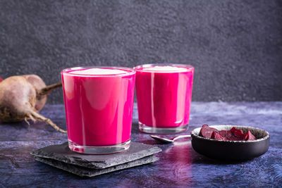 Vegetable beetroot latte in glasses on the table. coffee alternative.