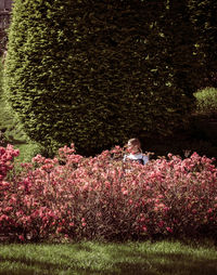 Woman with flowers on grass