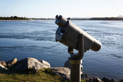 Coin-operated binoculars against lake