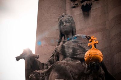 Low angle view of statue against sky