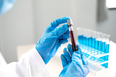 Cropped hand of scientist holding test tube at laboratory