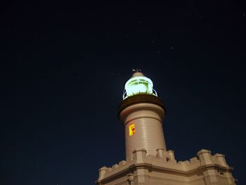 Low angle view of lighthouse at night