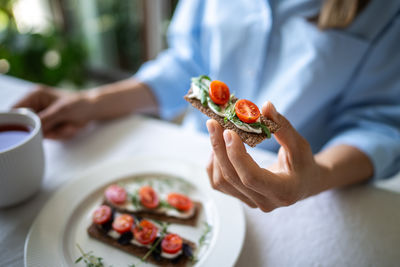 Midsection of woman holding food