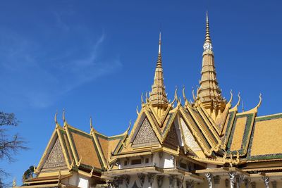 Low angle view of temple building against blue sky