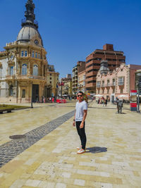 Rear view of man walking on street