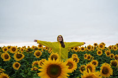 Full length of sunflower in field against sky