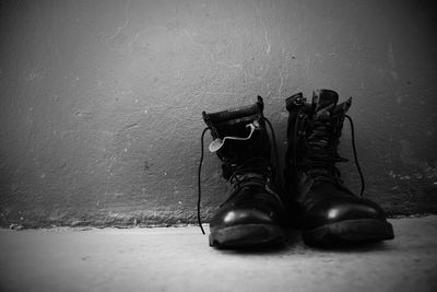 Close-up of shoes on wall