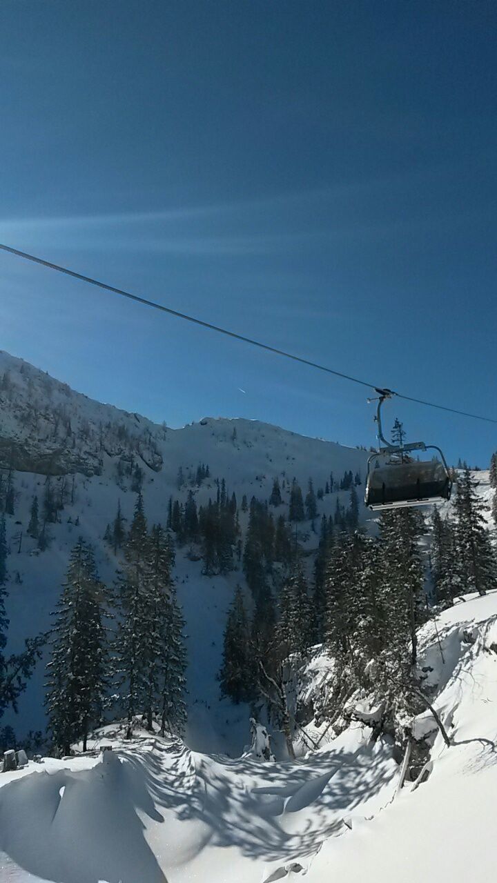 snow, winter, cold temperature, transportation, landscape, scenics, tranquil scene, tranquility, beauty in nature, sky, mountain, nature, blue, season, power line, mode of transport, tree, clear sky, non-urban scene, outdoors